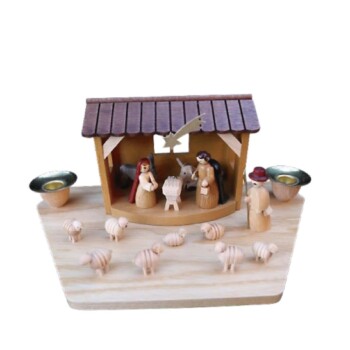 Nacimiento en portal con dos velas